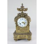A 19th century French gilt brass mantle clock, the enamel dial with Arabic and Roman numerals, the