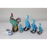 Four Chinese ceramic models of ducks, of graduated size, in turquoise and purple glaze, tallest 16.