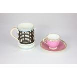 An 18th /19th century teacup and saucer, possibly Worcester, of ribbed form, decorated in pink