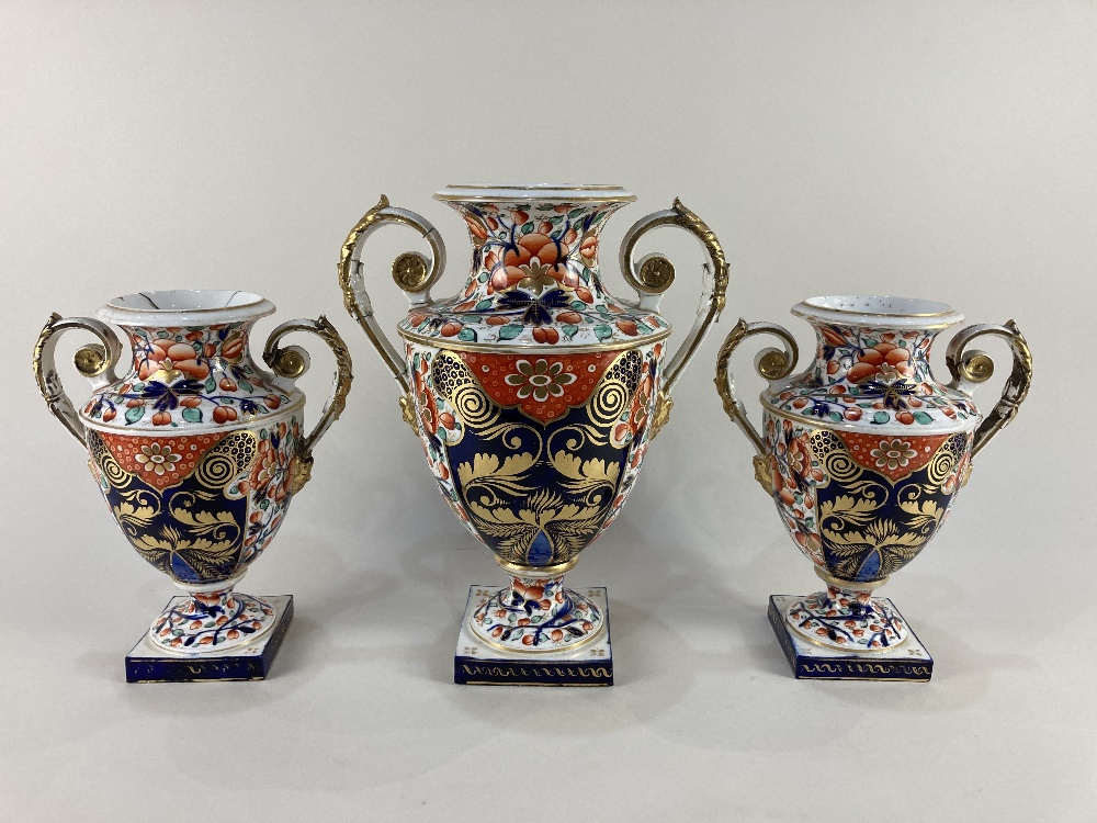 A 19th century Derby porcelain baluster urn, decorated in the Imari pattern, the two scroll