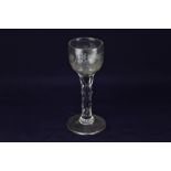 An 18th century wine glass, ovoid bowl engraved with a Jacobite rose and leaf spray with one bud,