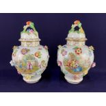 A pair of Dresden porcelain vases and covers, of baluster form, with applied flowers, and scenes
