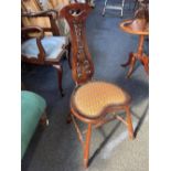 An early 20th century Spinners chair with pierced scroll back, heart shaped tapestry seat on