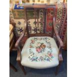An Edwardian inlaid carver dining chair with pierced panel back, scroll arms and tapestry seat on