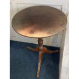 A Victorian mahogany tilt-top circular table on turned column and tripod base, 52cm