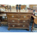 A George III mahogany chest of two short over two long drawers, with cross banding and herringbone