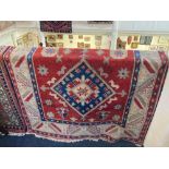 A Persian style rug, cream ground, with geometric decoration and two diamonds to the centre,