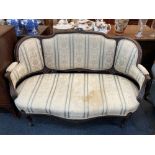 A Victorian mahogany two seat settee with carved floral, shell and acanthus leaf decoration,