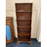 A mahogany narrow waterfall bookcase, of five graduated shelves, on bracket feet, 48cm wide by 120cm