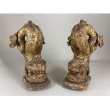 A pair of 19th century carved gilded wood dolphin or sea serpent furniture supports / mounts, (a/