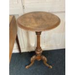 A Victorian walnut circular occasional table inlaid top on baluster stem and three foliate carved