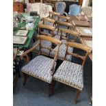 A set of eight nineteenth century mahogany dining chairs including two carvers with carved