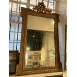 A giltwood and gesso rectangular wall mirror stepped corners with pierced scroll surmount and scroll