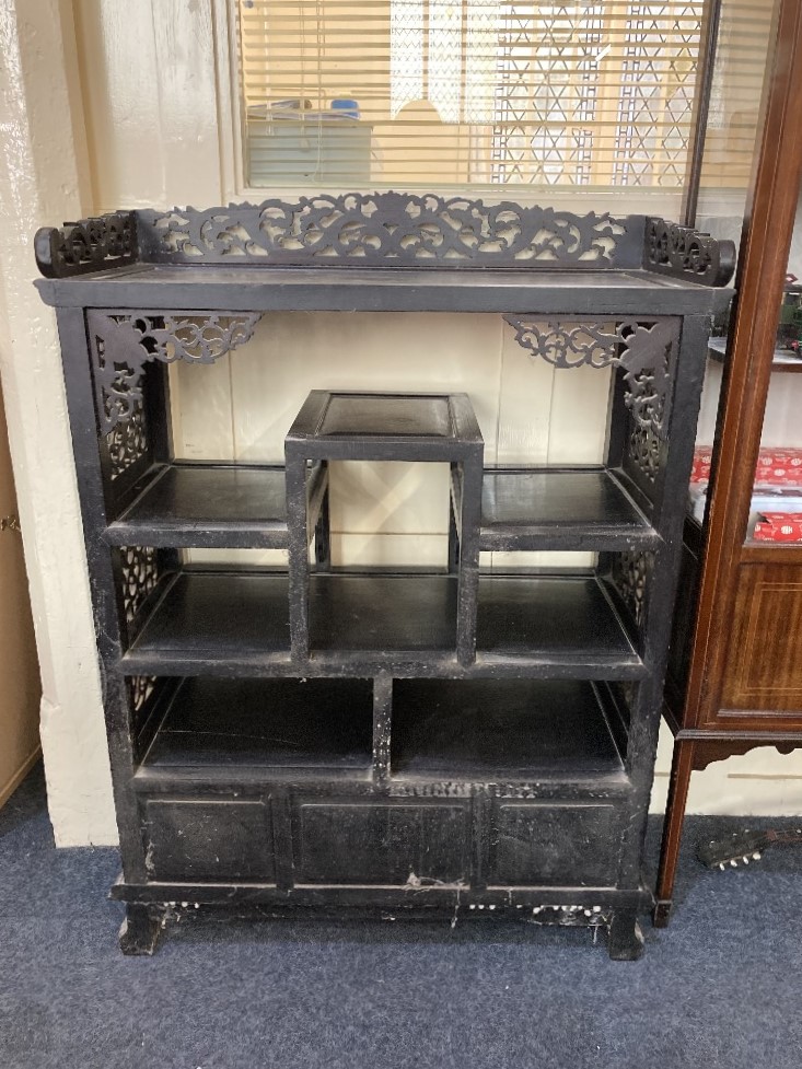 A Chinese carved hardwood display cabinet with pierced scroll gallery surmount above an - Image 2 of 2