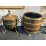 A Sheraton style brass coal scuttle with domed lid and vase handle, metal liner and loop handles