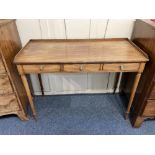 An early 19th century mahogany dressing table rectangular top with three quarter gallery and three