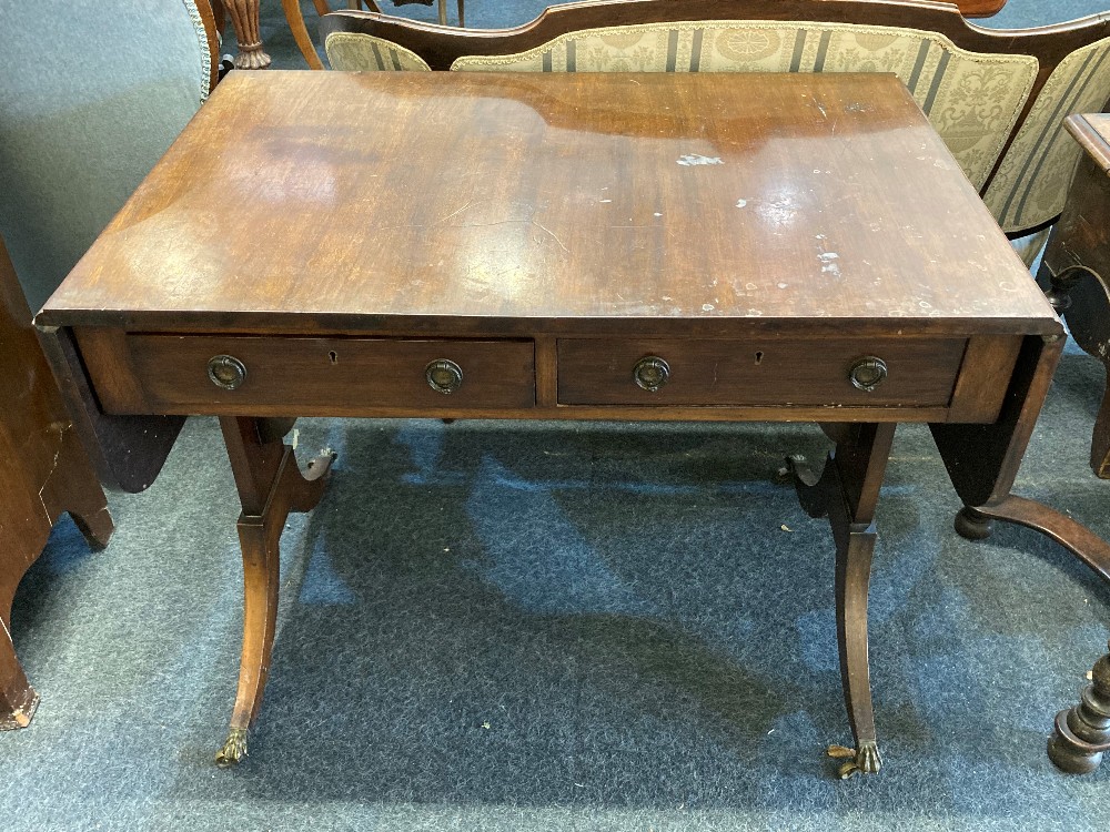 A mahogany sofa table rectangular top with two drawers and drop ring handles on end supports with