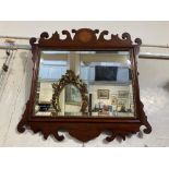 A George III mahogany fret cut wall mirror with inlaid satinwood patera and parcel gilt, 56cm by