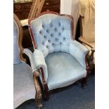 A blue button upholstered armchair with mahogany show frame, on cabriole legs