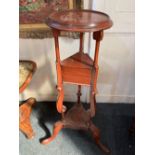A reproduction mahogany George III wig stand with circular dished top for pot stand, above two small