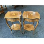 A pair of French style gilt metal mounted two-tier side tables with floral inlaid serpentine oval