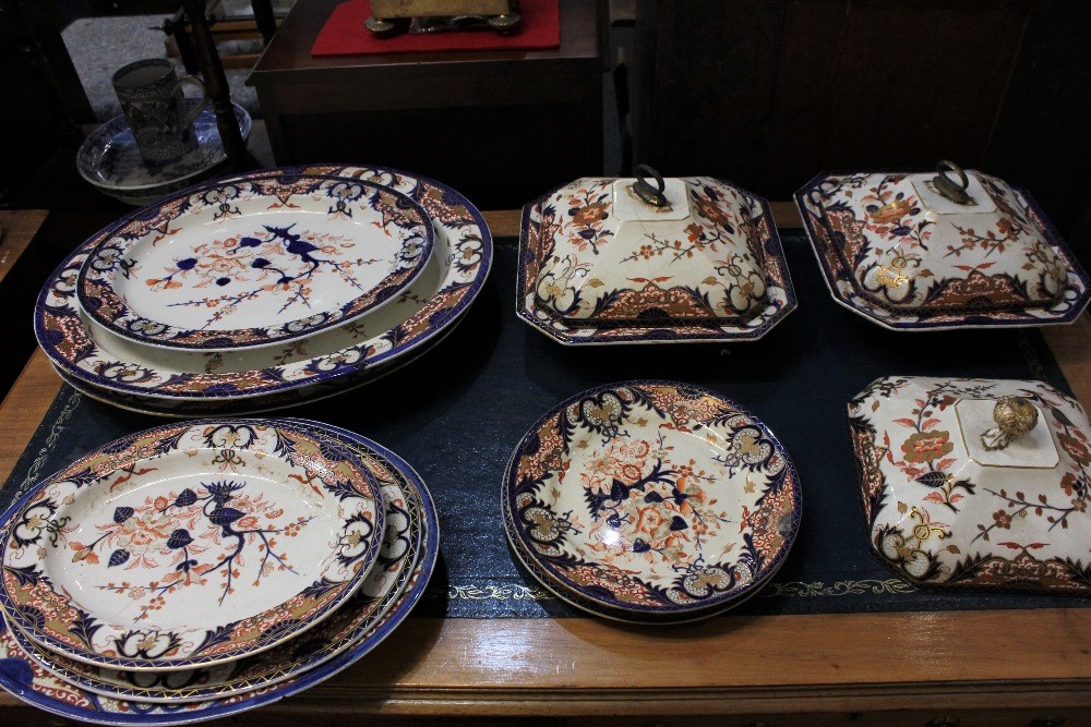 An 18th century and later Derby porcelain part dinner service, decorated in the Imari palette,