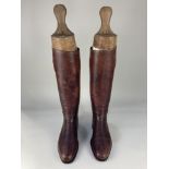 A pair of brown leather riding / polo boots, UK size 9, with boot trees by Tom Hill (