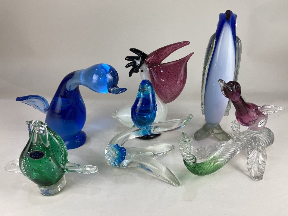 A collection of six various coloured glass models of birds, to include a pelican, 24cm high, and a