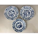 Three similar Meissen porcelain 'onion' pattern plates, in blue and white, each with wavy rim,