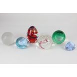 Four Caithness glass paperweights, comprising 'Scarlet Twister', 'Pink Champagne', 'Pastel' and '