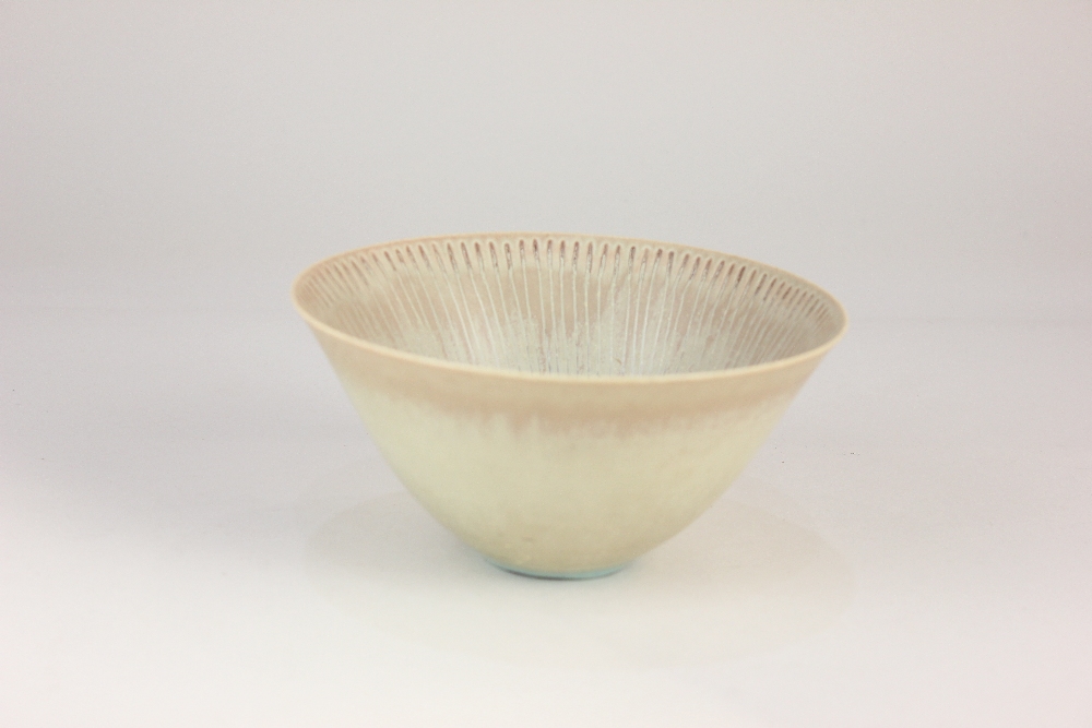 A Stig Lindberg for Gustavsberg, Sweden conical bowl, cream glaze with radiating horizontal lines to
