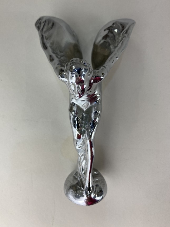 A Spirit of Ecstasy car hood mascot, etched mark Trade Mark Reg: US Pat Off, 13cm high