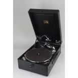 A 'His Master's Voice' black cased portable gramophone player, with winder