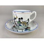 A Royal Paragon China Mickey Mouse series teacup and saucer, the cup stating 'Let's be as happy as