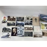 A collection of black and white and colour postcards, including a set of six Festival of Britain
