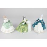 Three Royal Doulton figures of ladies, comprising 'Regal Lady', 'Secret Thoughts', and 'Soiree',