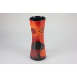 A Poole pottery Form vase by Andrew Tanner, decorated with a silhouette of a tree beneath a red sun,