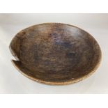 A 19th century carved sycamore dairy bowl 37cm diameter