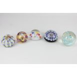 Three millefiori glass paperweights, to include one by Strathearn, a Caithness 'Mooncrystal'