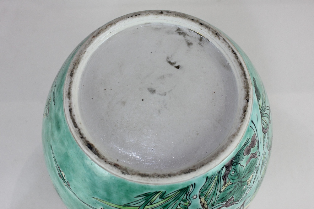 A porcelain ginger jar and cover, decorated with birds amongst flowering branches, on green - Image 2 of 2