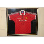 David Beckham; a signed Manchester United football shirt, in glazed frame, frame 79cm by 89cm