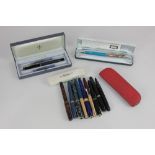 Two Parker fountain pens, cased, together with a small collection of fountain pens, some Parker