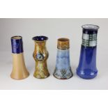 A collection of four various Royal Doulton stoneware vases, of chimney shaped form, to include one