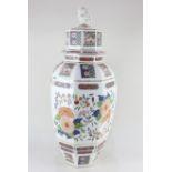 A large Oriental porcelain jar and cover, of hexagonal baluster form, with floral decoration in