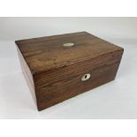 A Victorian rosewood workbox, with monogrammed mother of pearl inlaid cartouche, (a/f) 27.5cm wide