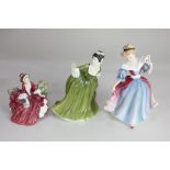 Three Royal Doulton porcelain figures of ladies, comprising 'Figure of the Year 1991 Amy', 'Simone',