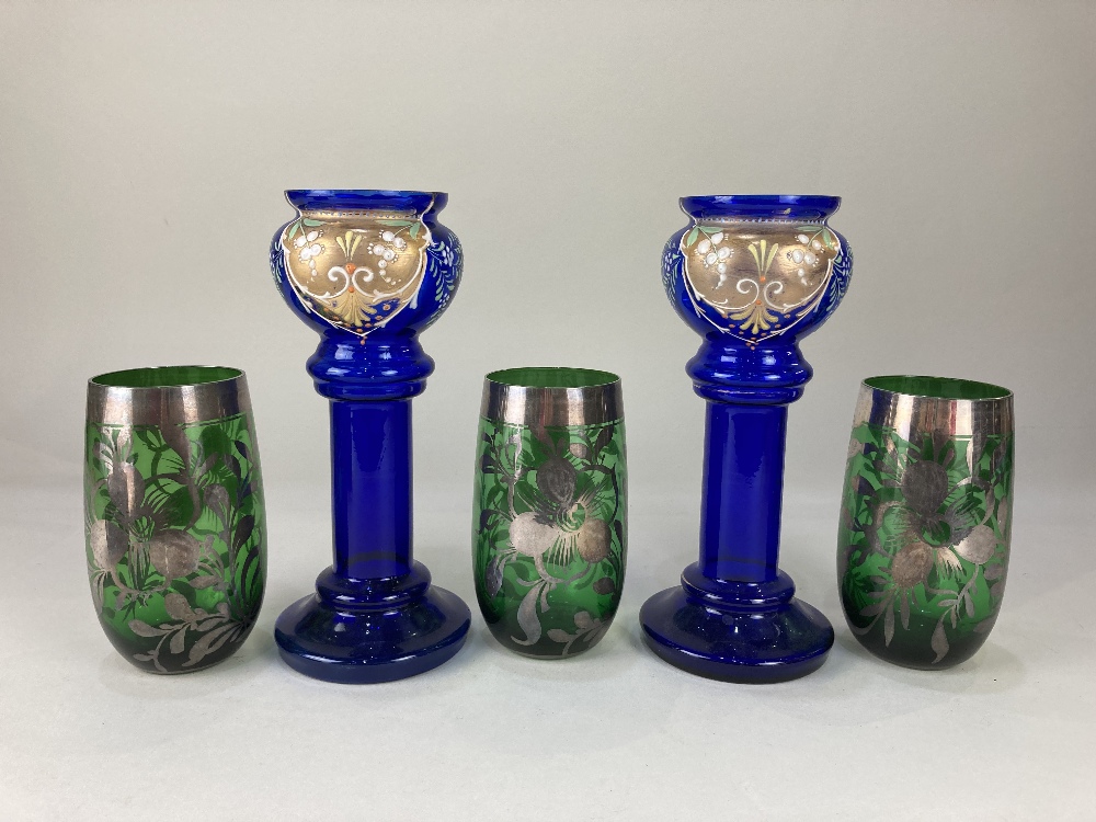 A pair of Victorian Bristol blue glass vases, with gilt and painted mistletoe design, together