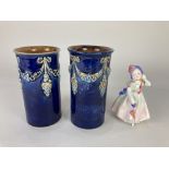 A pair of Royal Doulton pottery vases, with raised floral ribbon swag design, together with a