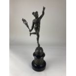 A bronze figure of a herald from Greek mythology (possibly Iris, messenger of Hera) holding a