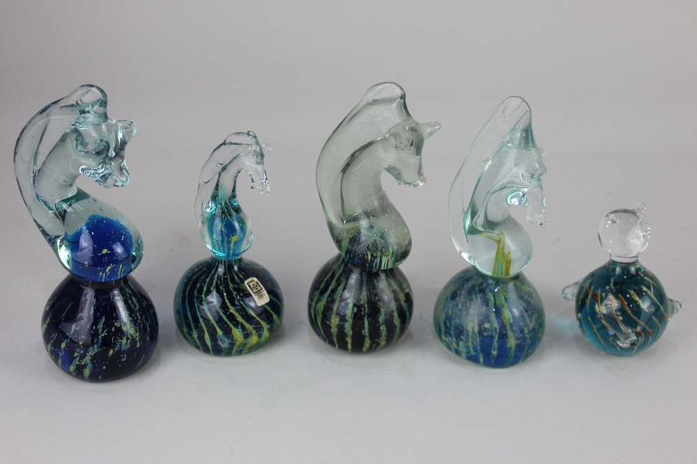 Four Mdina glass seahorse paperweights, tallest 17cm high, together with a similar paperweight in